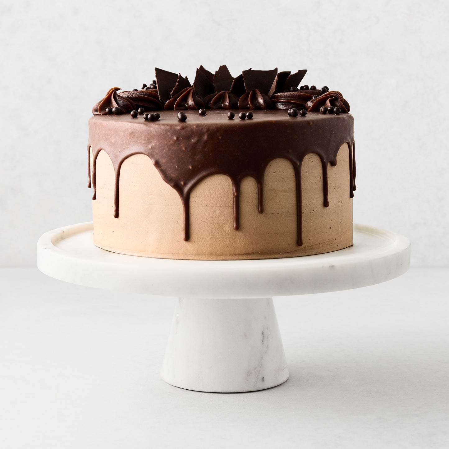 White marble cake stand, 12"Dia x 4.5"H, with a chocolate cake.