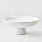 White marble footed serve bowl, 12"Dia x 4.75"H, with sleek curved edges and sturdy base.