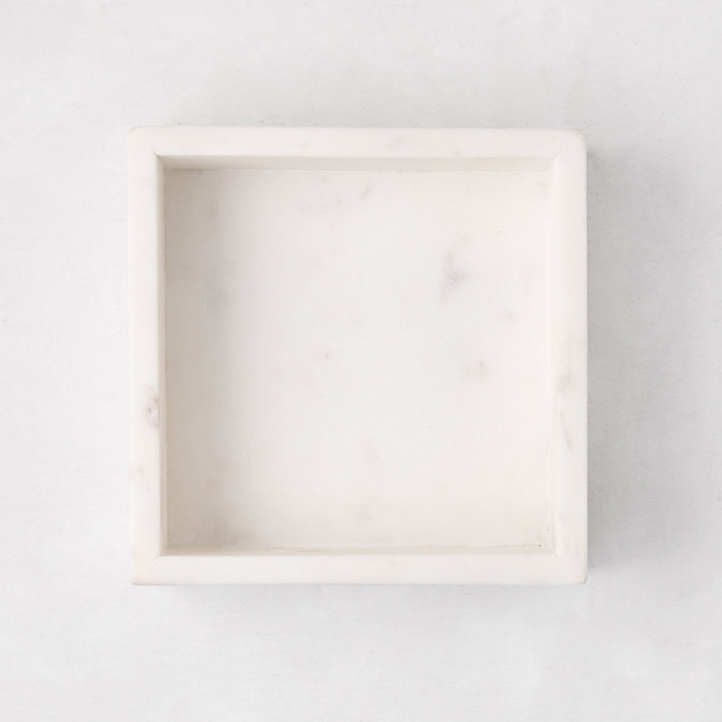 White marble square napkin holder, 5.75"L x 5.75"W, with subtle veining.