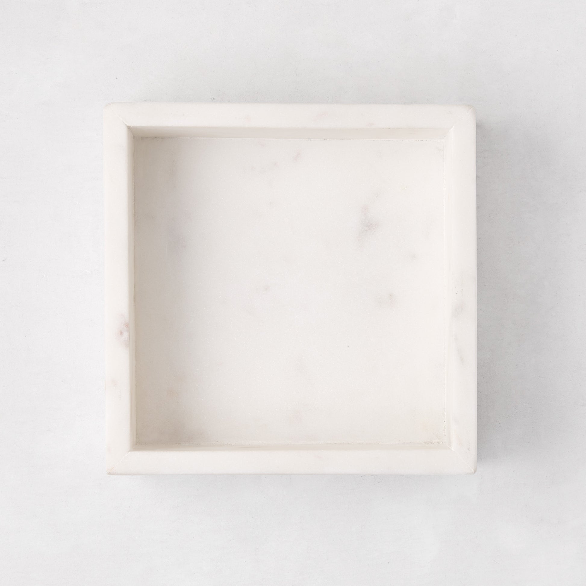 White marble square napkin holder, 5.75"L x 5.75"W, with subtle veining.