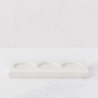 White marble triple soap and lotion tray with three circular indentations.