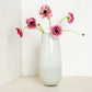 White Margaux Vase, 14.5"H handblown glass, with pink ranunculus flowers.