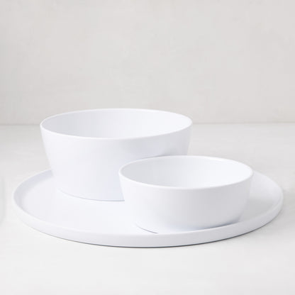 HG White Melamine Serve Bowl, 9"Dia x 3.78"H, with a smaller bowl and plate, on a white surface.