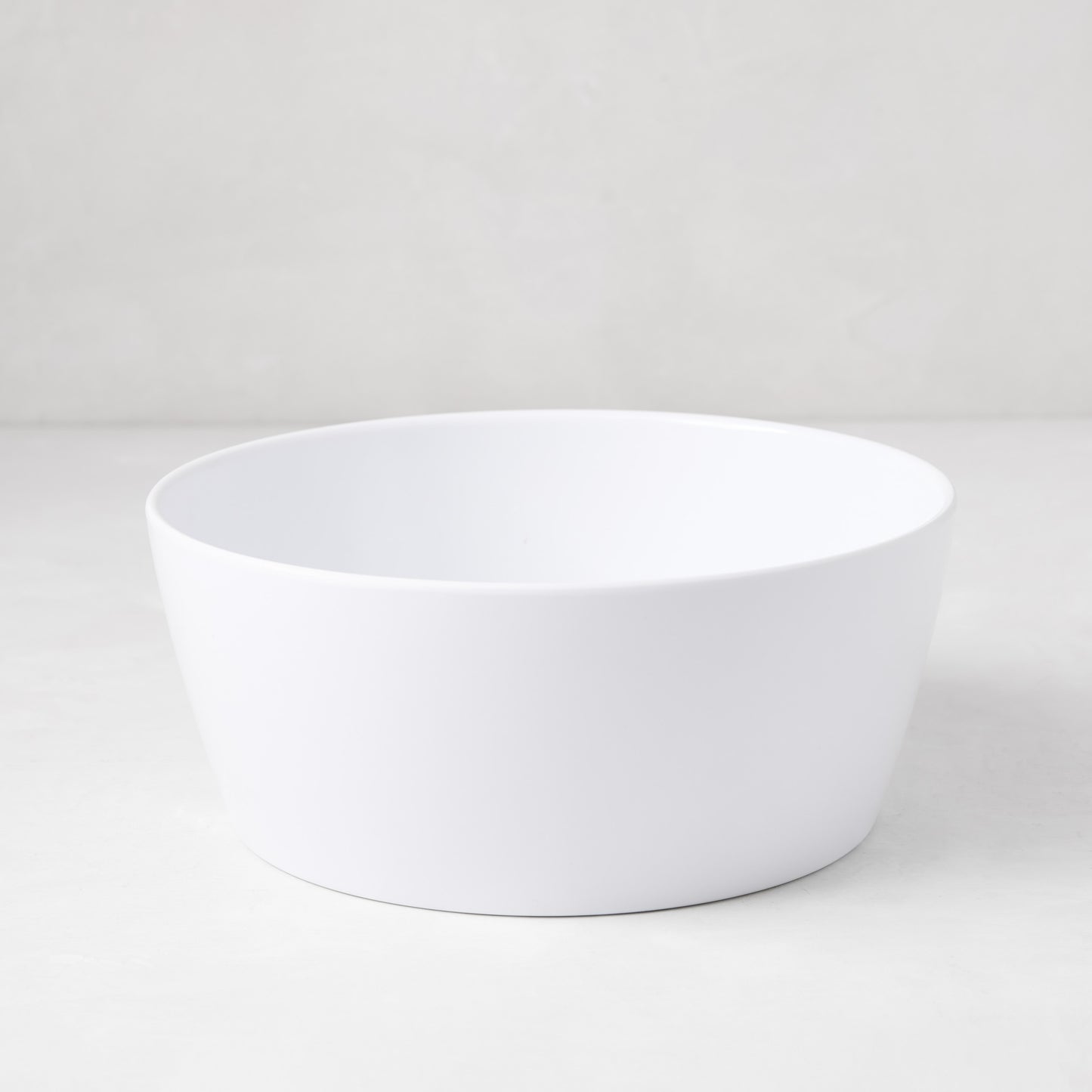 HG White Melamine Serve Bowl, 9"Dia x 3.78"H, with a modern lipped design.