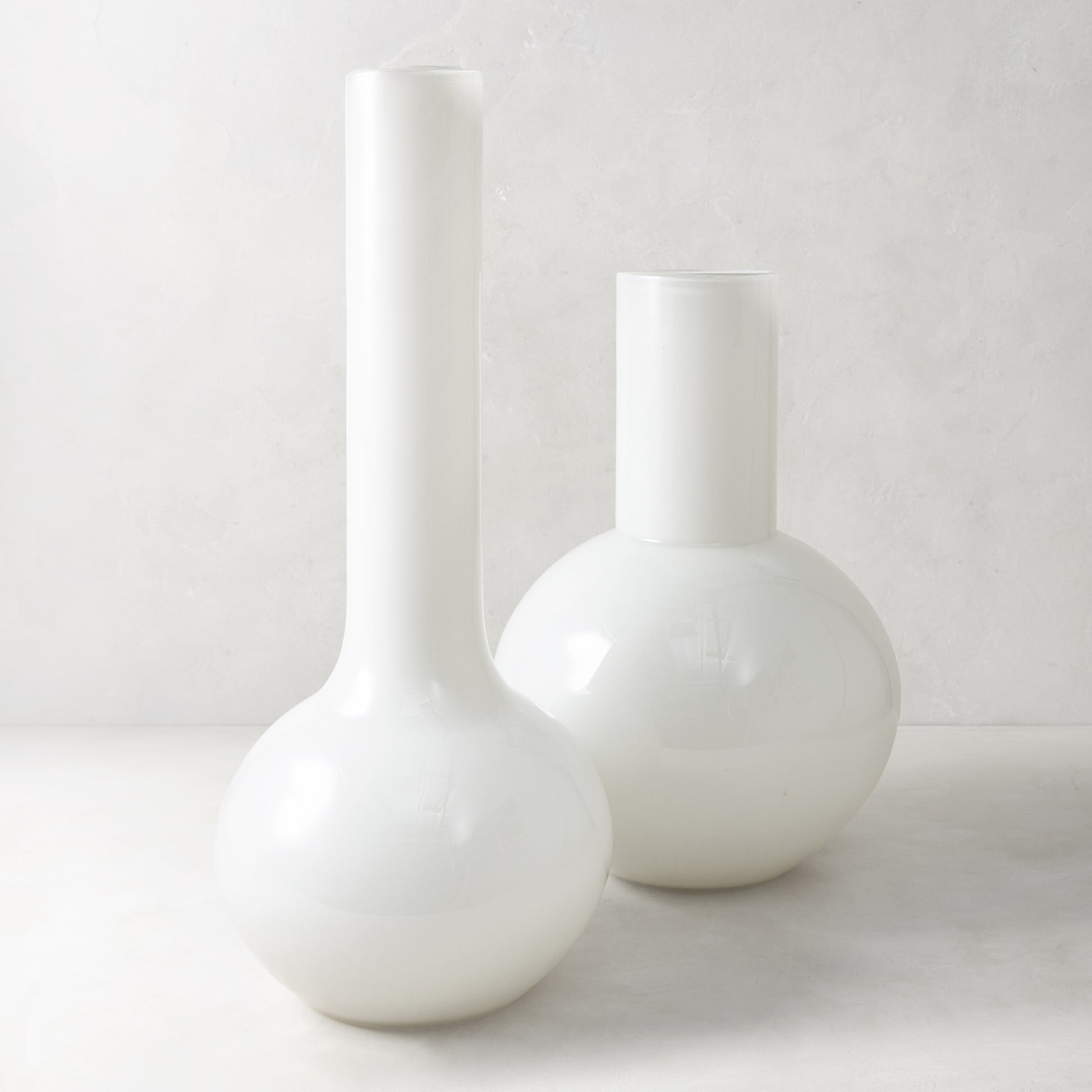 White oversized Grando glass vase, 18.8"H, with a round base and tall narrow neck.