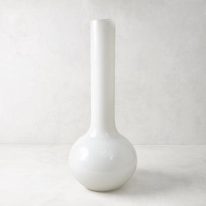 Oversized opaque white Raymond glass vase, handblown in Europe, with a round base and tall, slender neck.