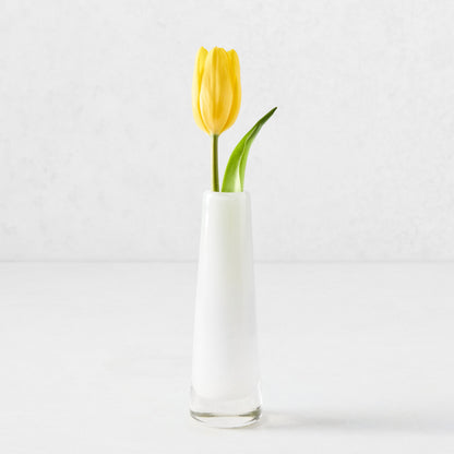 White Solifleur small glass bud vase with a single yellow tulip.