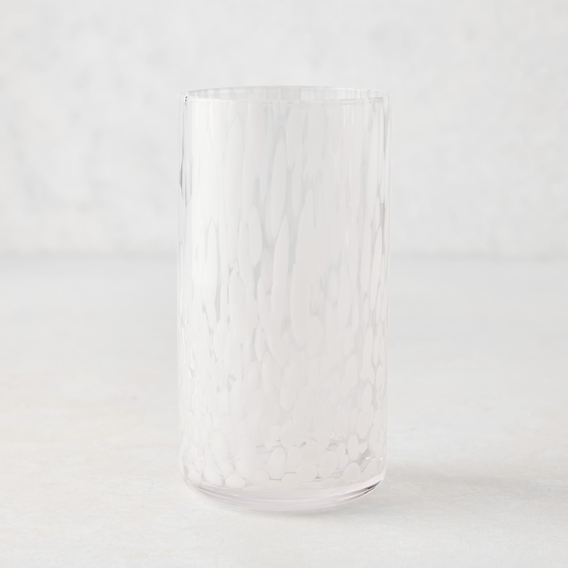 White Spotted Highball Glass, clear glass with opaque white spots, 15.22 oz.