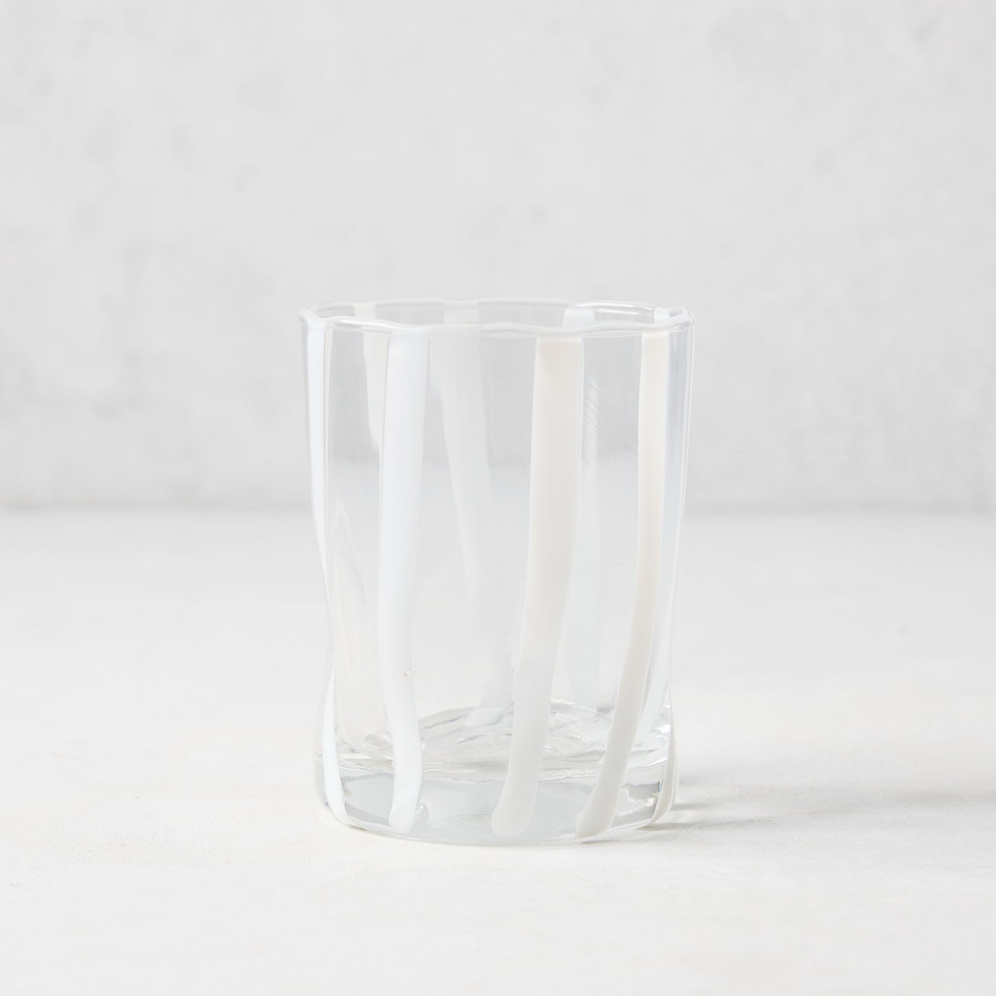 Hand-made Italian clear double old fashioned glass with vertical white stripes.