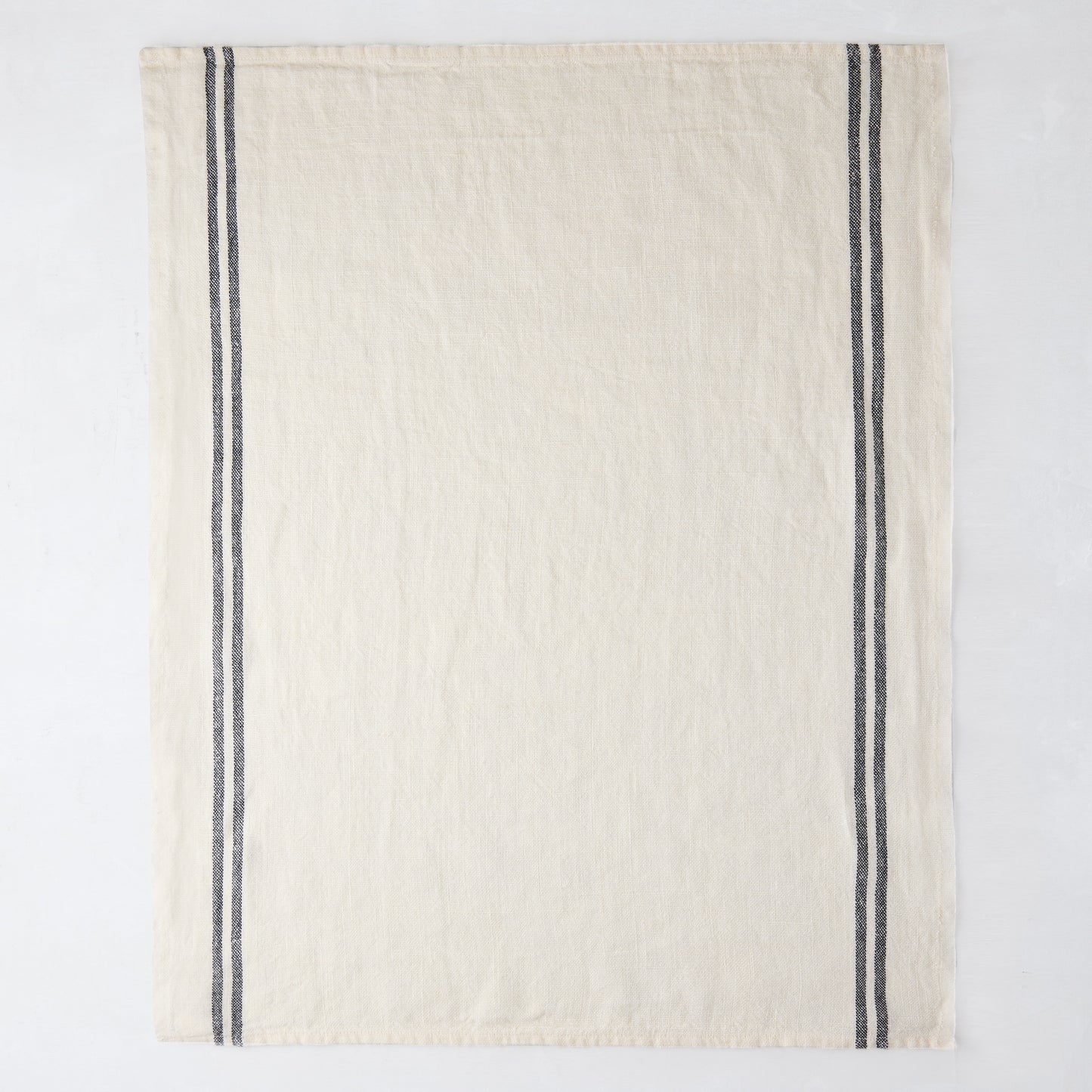 White French linen hand towel with two vertical black stripes.