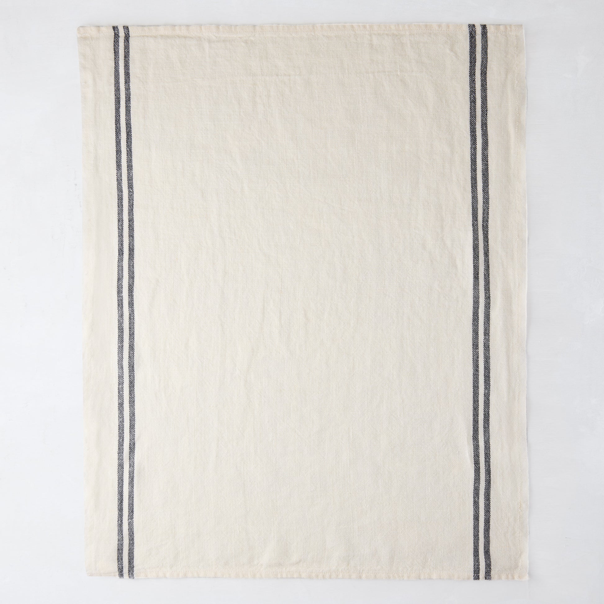 White French linen hand towel with two vertical black stripes.