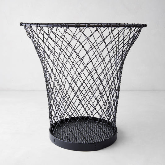 Black wire waste bin made of woven iron, 12"H, with a flared top and solid base.