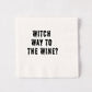White 5.5-inch square 3-ply paper cocktail napkin with black dripping text reading Witch Way to the Wine.