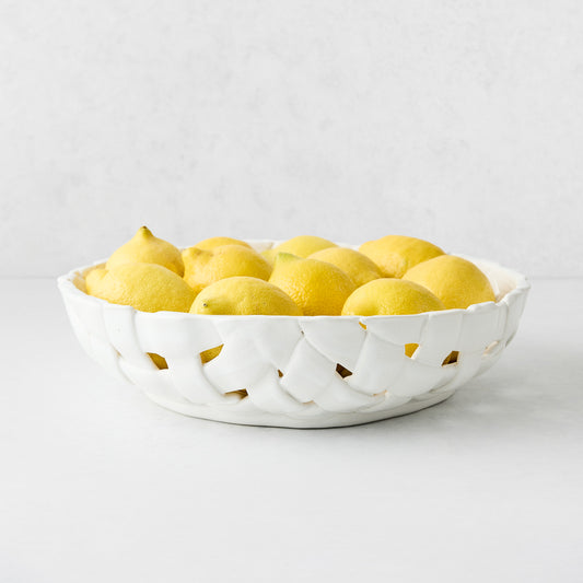 White woven ceramic fruit bowl filled with fresh yellow lemons, 12.6-inch diameter, Italian-made design.