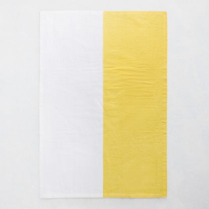 Yellow and white half-patterned cotton-linen hand towel, block print style.