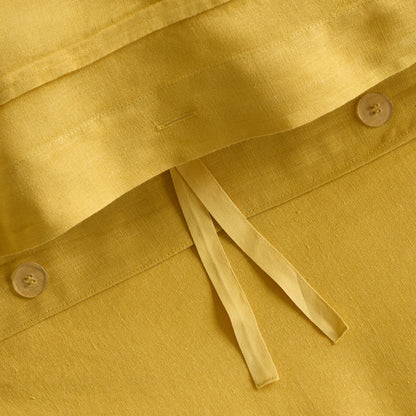 Yellow European washed linen duvet cover with button closures and fabric ties.