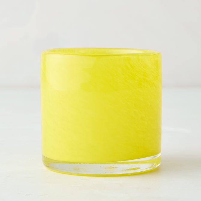 Bright yellow glass votive candle holder, 2.75" tall, with subtle swirled texture.