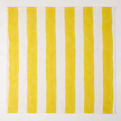 Yellow Hampton Stripe Cotton Napkin, 22" square, with bold yellow and white vertical stripes.