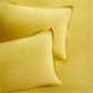 Set of 2 yellow washed Italian linen pillow shams with 2" flange and double-needle stitching.