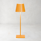 Yellow Poldina Pro rechargeable LED lamp with a modern, sleek, minimalistic design and powdercoat finish.