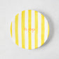 Hand-painted ceramic appetizer plate with bright yellow stripes and orange "la plage" text.