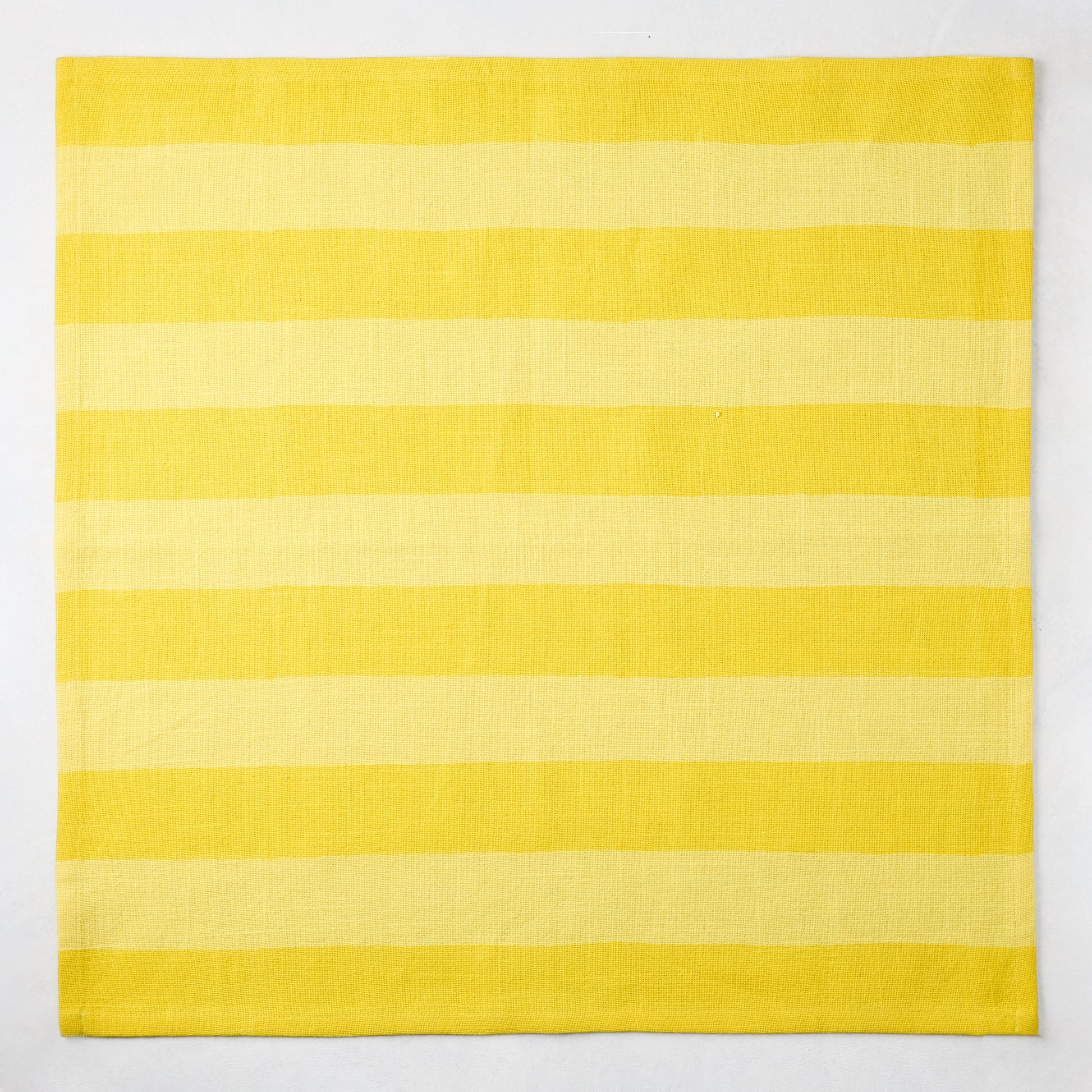 Yellow Tonal Hampton Stripe Cotton Napkin, 22" square, with bold two-toned yellow stripes.
