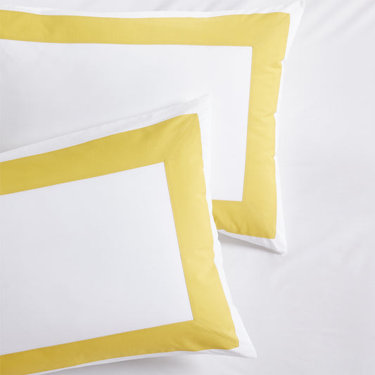 Two yellow wide-band percale pillow shams, 500-thread-count extra-long staple cotton.