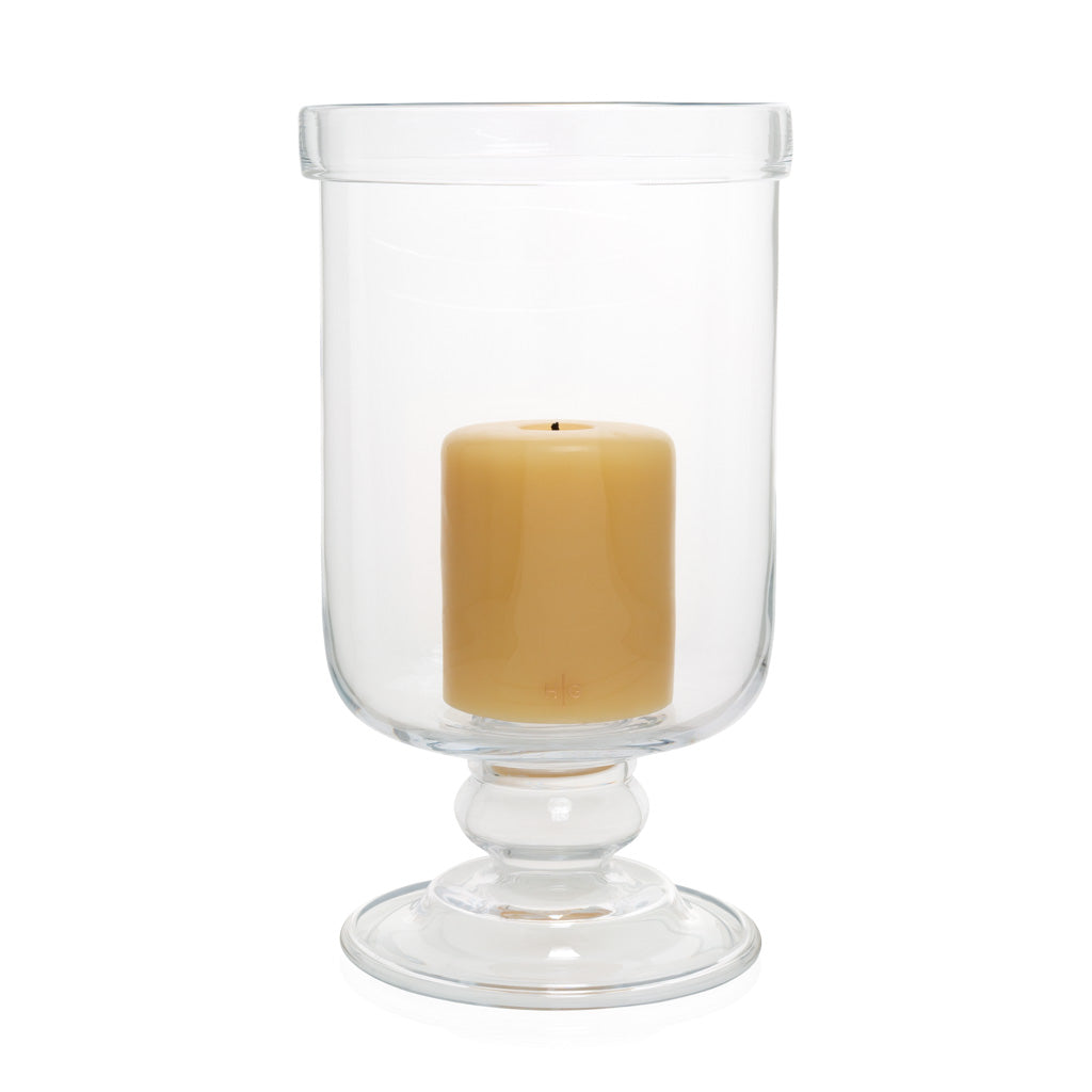 large glass footed candle holder inside outdoor 