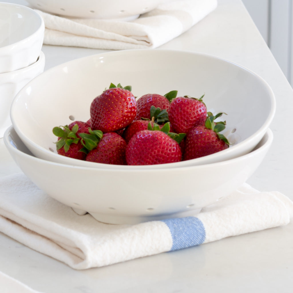 Hudson Grace White Ceramic Berry Bowl with fresh strawberries and a white linen towel