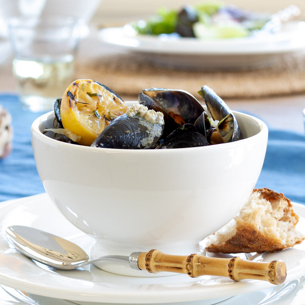 White ceramic bowl with mussels 