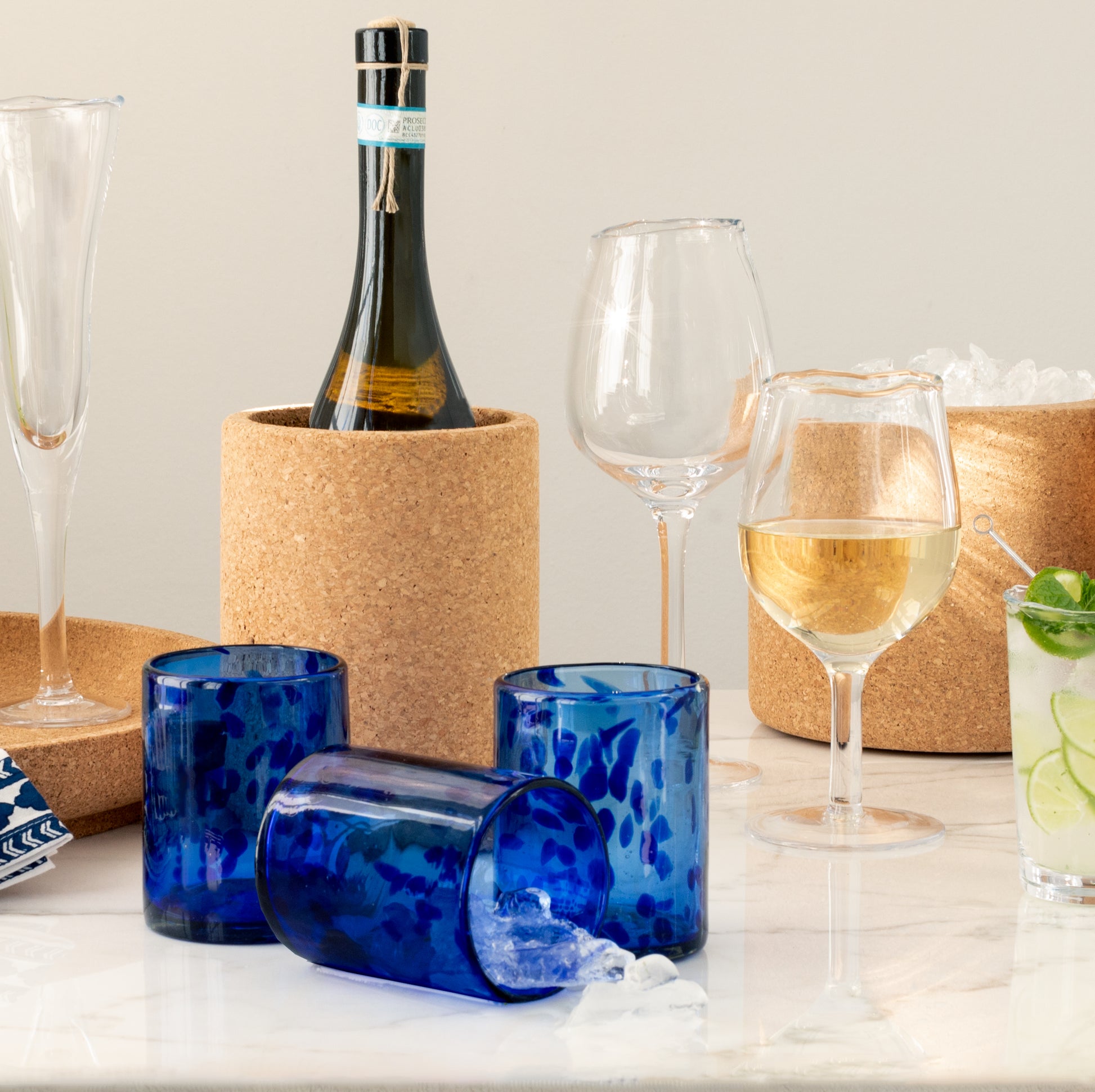 blue old-fashioned glass cork barware and sempre wine glasses