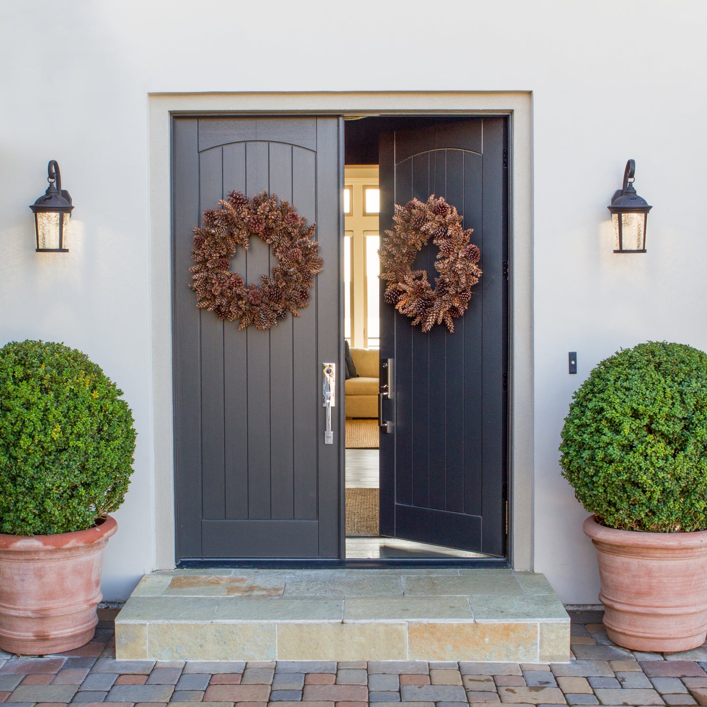 pinecone wreath on doors 