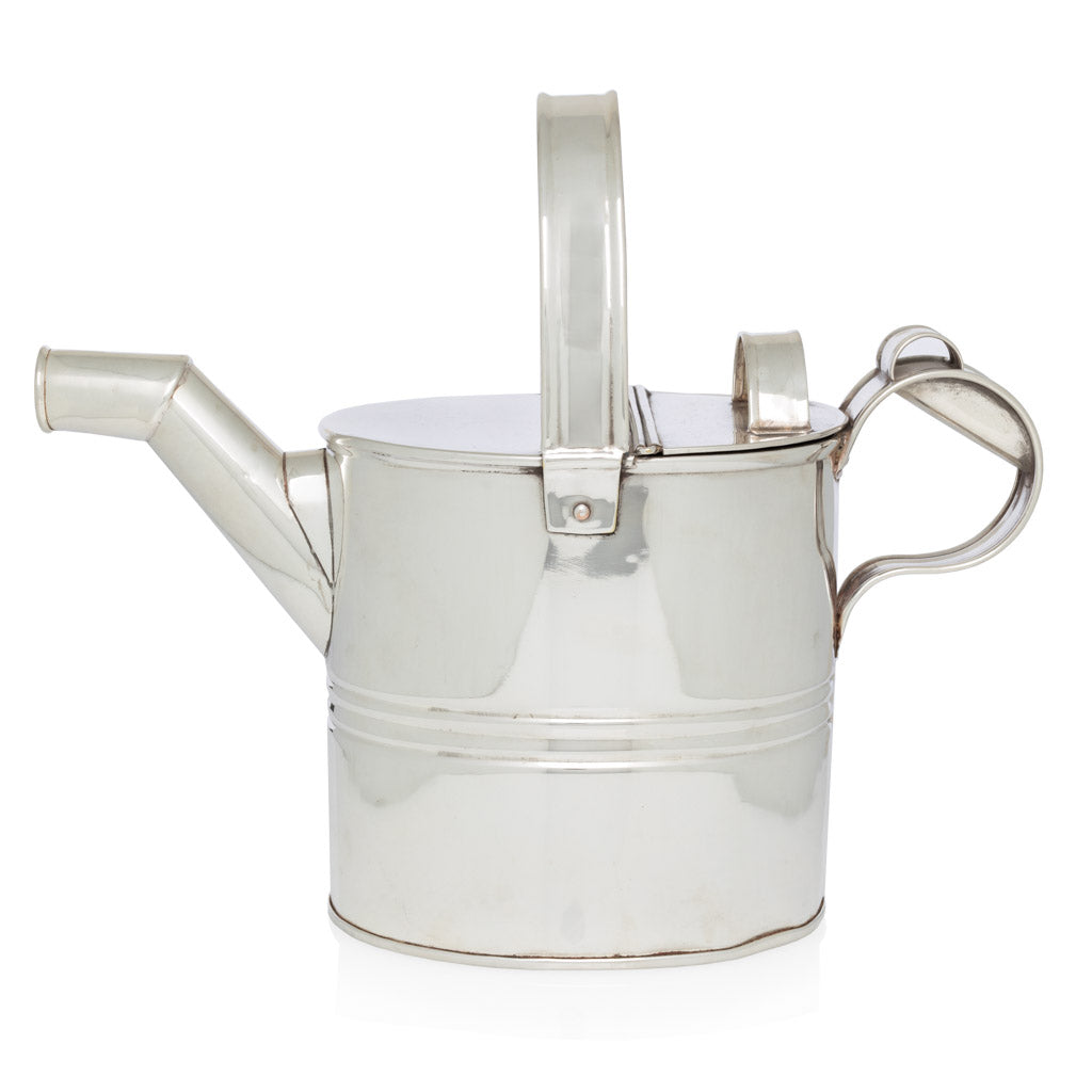 antique silver watering can with large handle and spout 