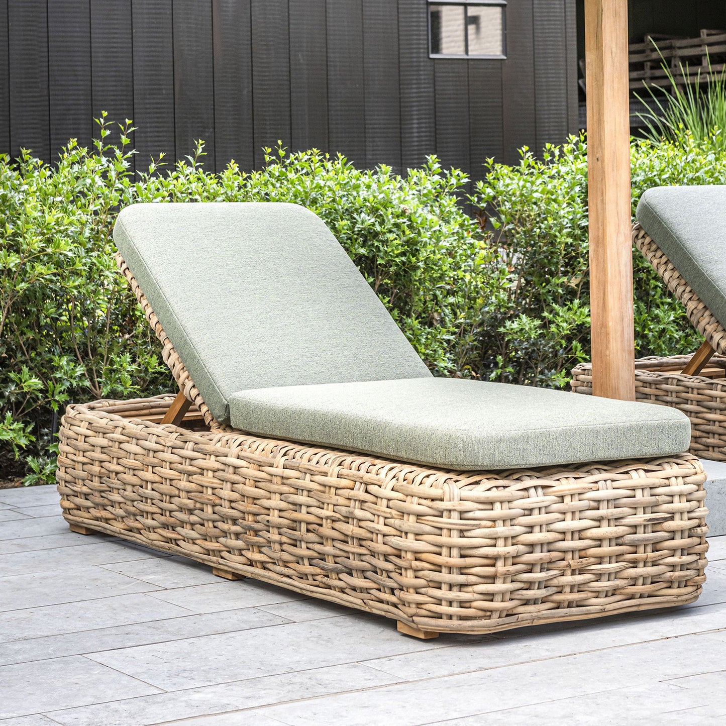 Woven wood sun lounger with gray cushion 