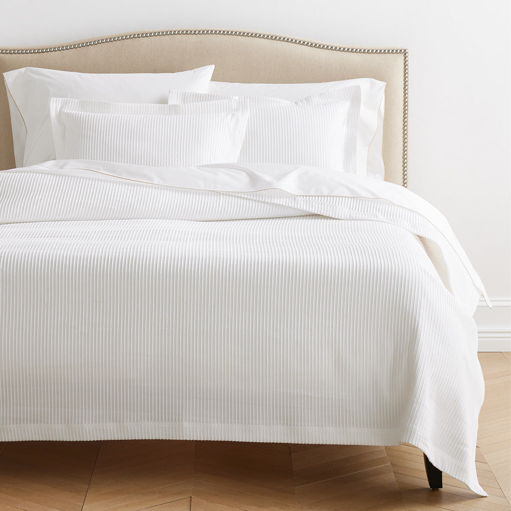 Ribbed White Cotton Matelassé Coverlet on bed