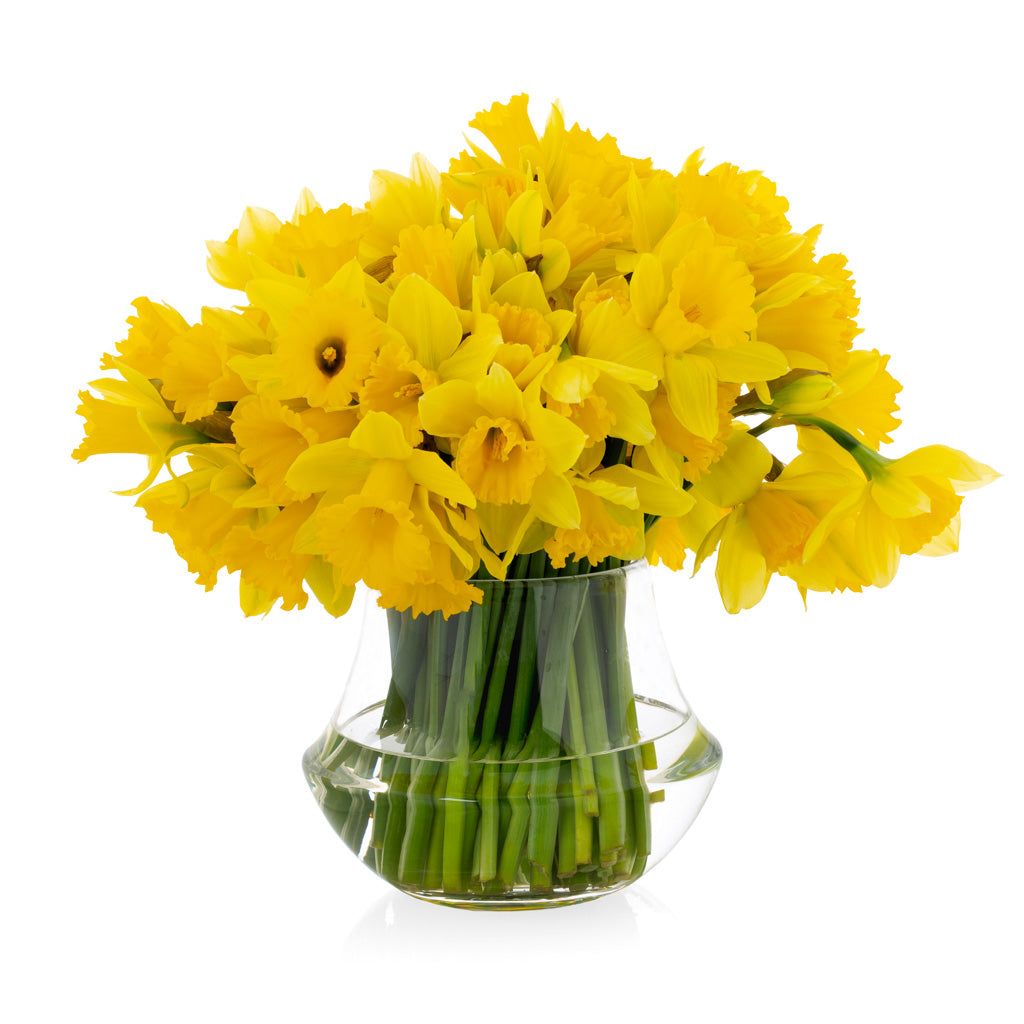 Mini glass vase with yellow flowers