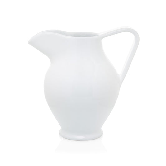Small white ceramic pitcher with large handle
