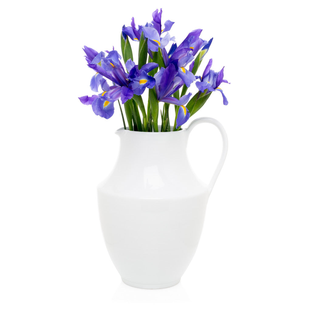 white ceramic pitcher with purple flowers