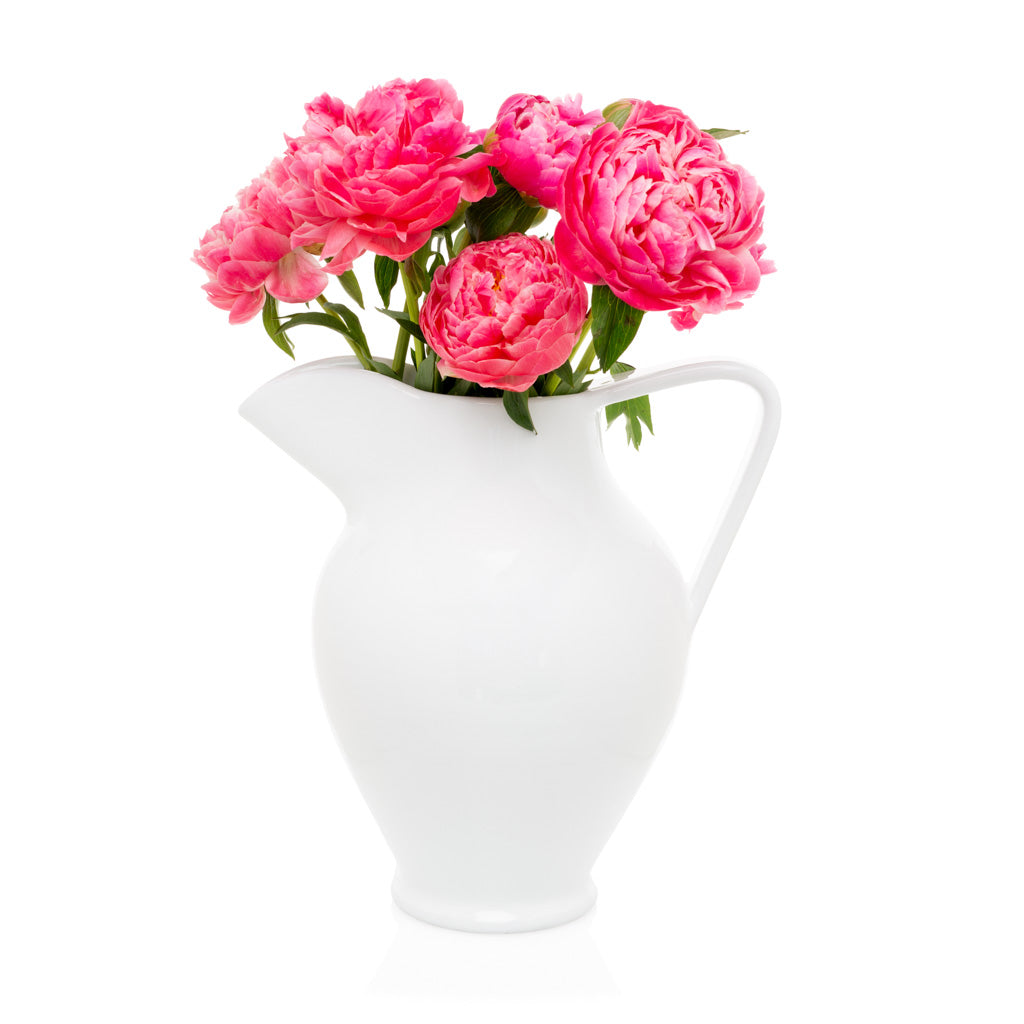 White ceramic pitcher vase with pink flowers
