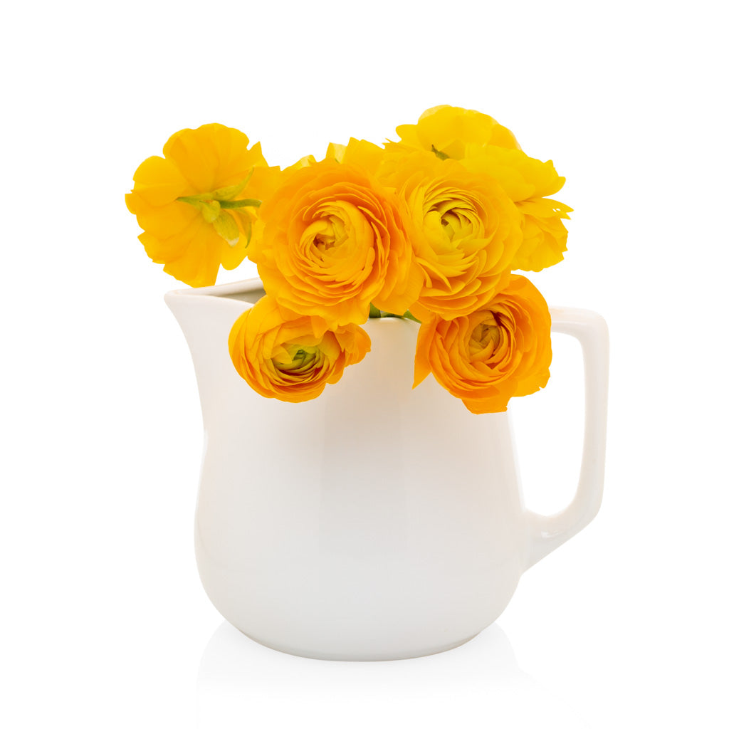 Milk pitcher with orange flowers