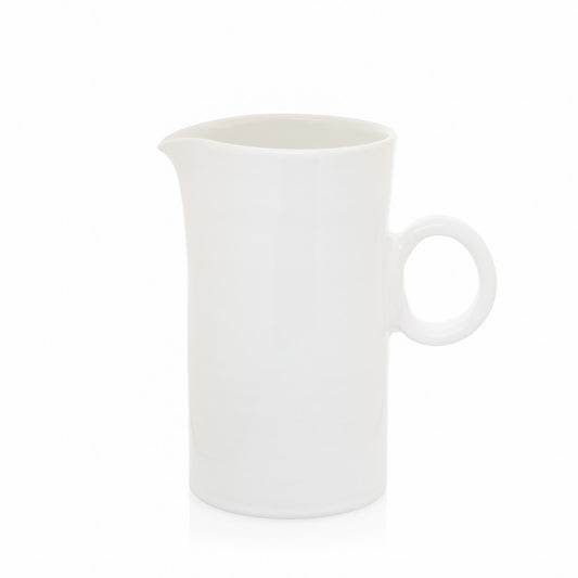 white ceramic pitcher with ring handle