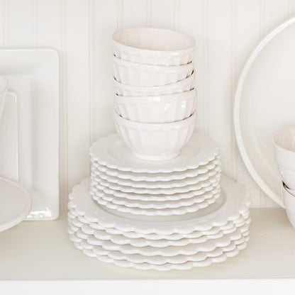 white ceramic scalloped edge plates