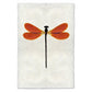 Amber Damsel Dragonfly print on textured handmade paper, featuring orange wings and a black body.