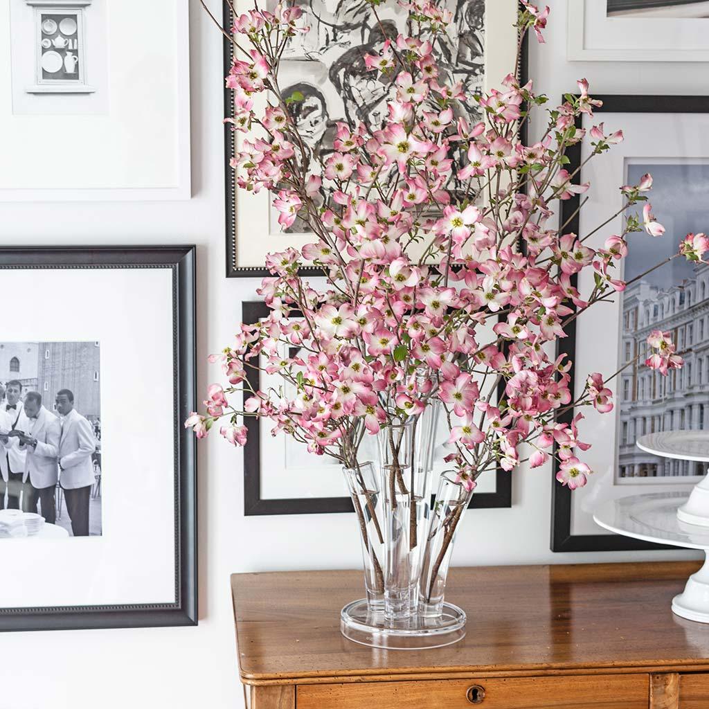 Angelina Small Scissor-Cut Glass Vase, clear, handmade, with stair-step fluted tubes and pink dogwood branches.