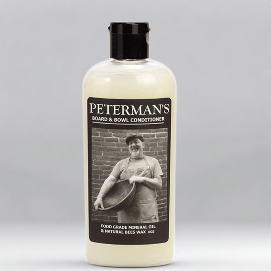 Peterman's 8oz Beeswax Conditioner for Wood Boards & Bowls, light bottle with black label featuring a man.