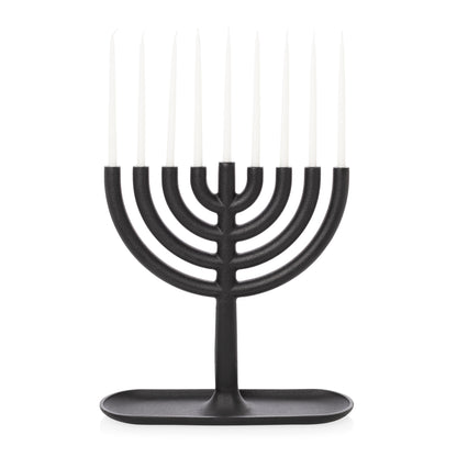 Black cast iron Hanukkah menorah by Josh Owen, 11"L x 11"H, with white taper candles.