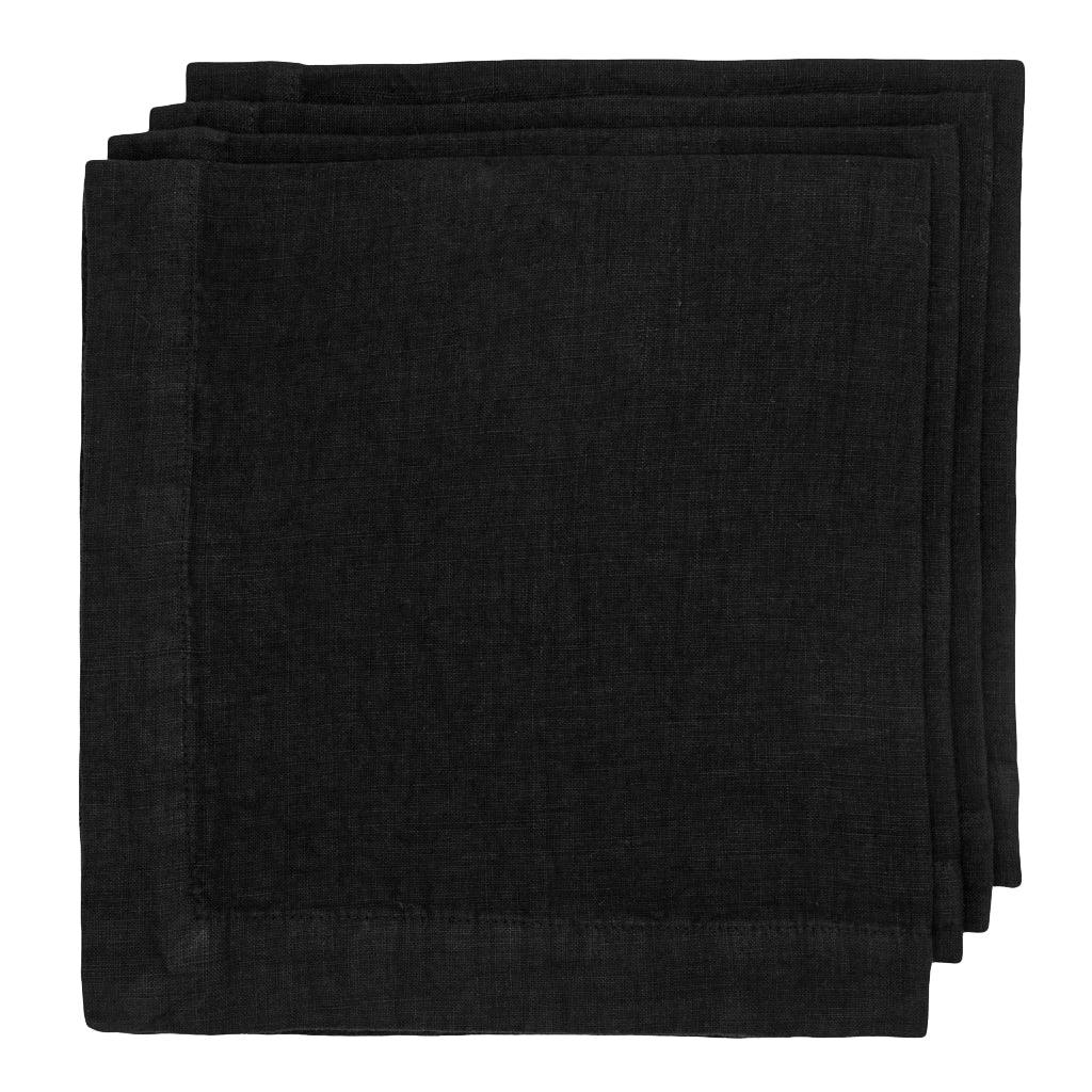 Stack of three Black HG Signature hand-dyed 22-inch square linen napkins with mitered corners.