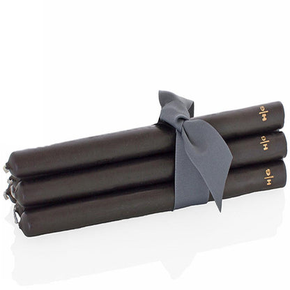 Three black 22" HG taper candles, hand-dipped paraffin, tied with a gray ribbon.