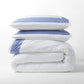 Blue Wide-Band Percale Duvet Cover and two shams, folded and stacked.