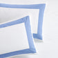 Set of 2 white percale pillow shams with a 4-inch wide blue appliqued border.